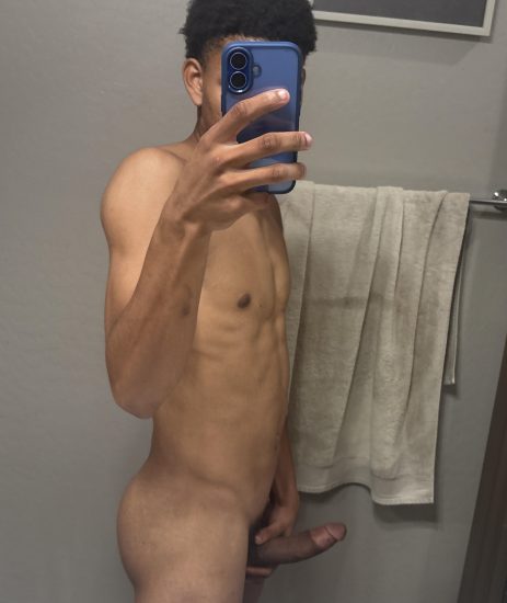 Black twink taking a nude selfie