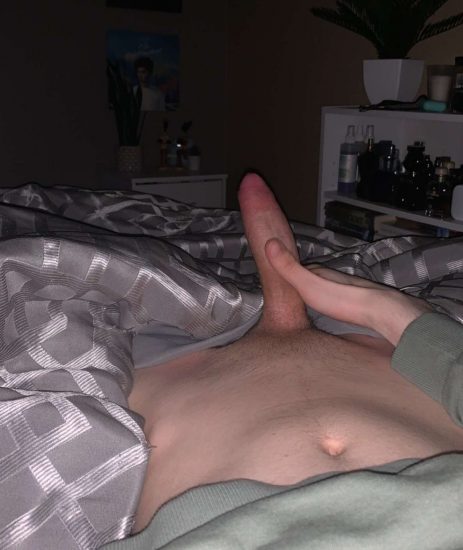 Boy in bed taking dick pics