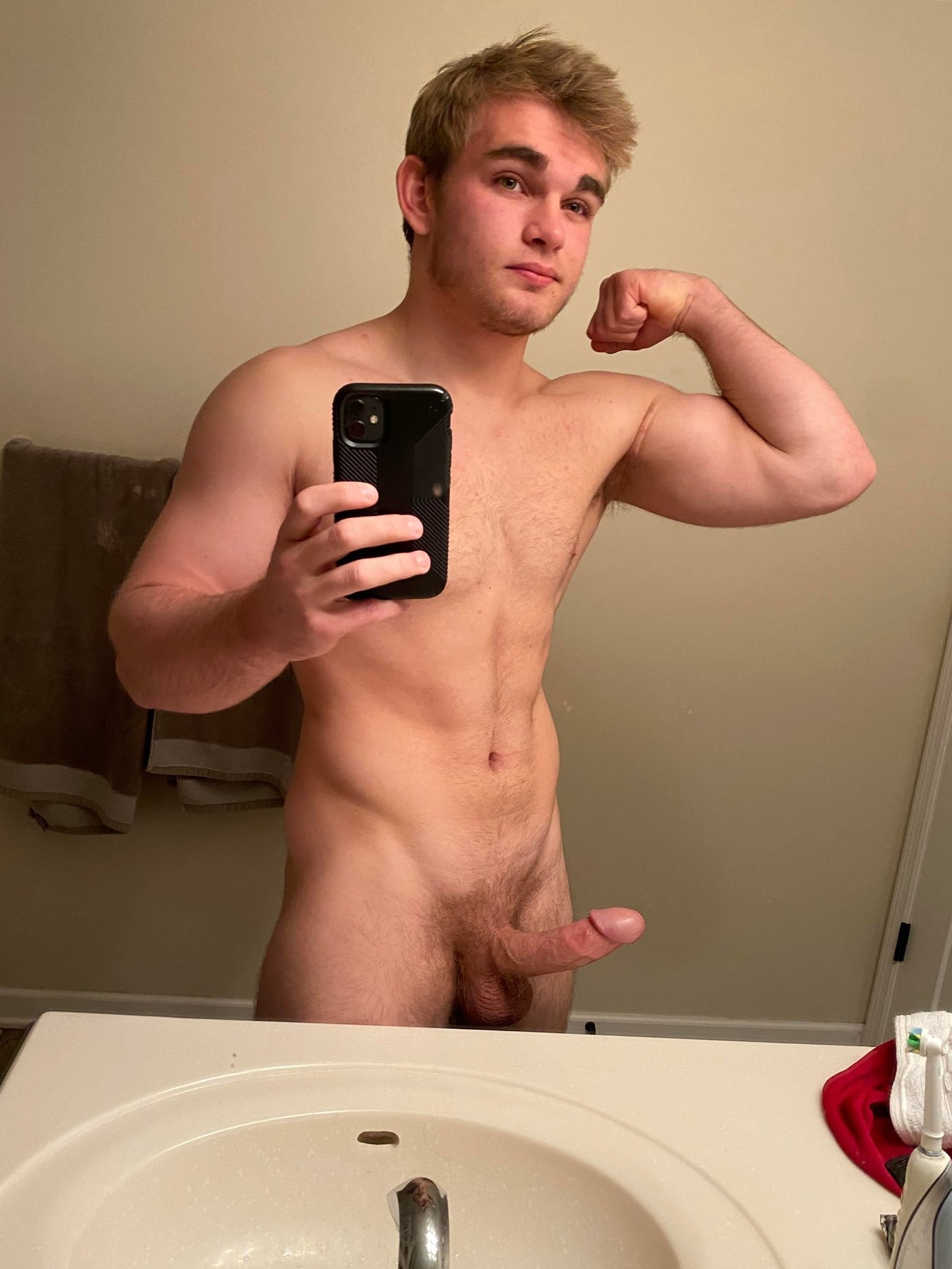 Horny nude boy flexing muscles