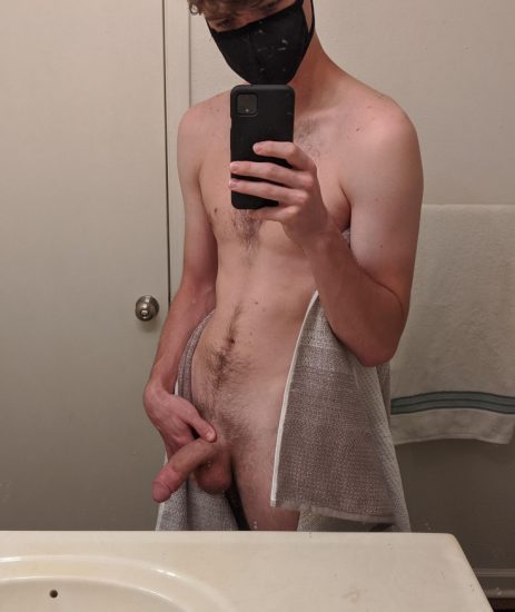 Masked boy taking a penis picture
