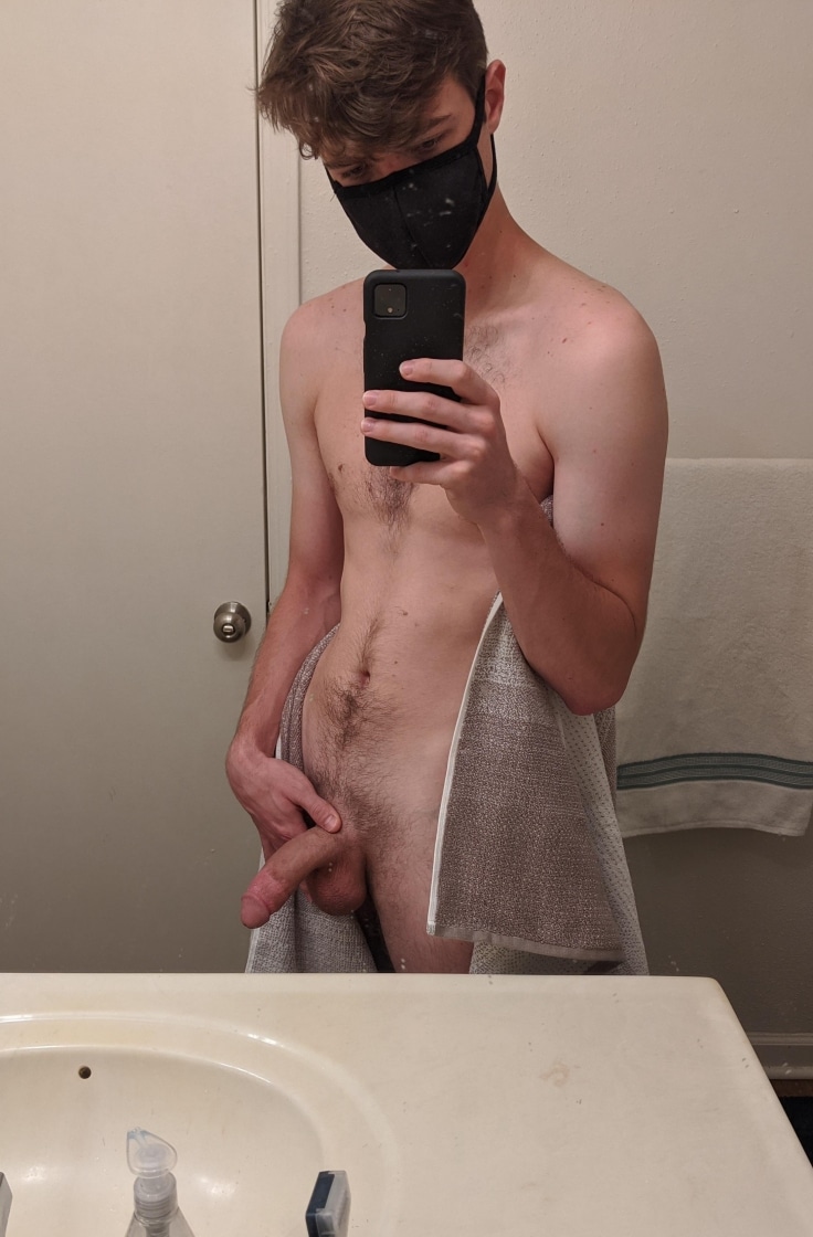 Masked boy taking a penis picture